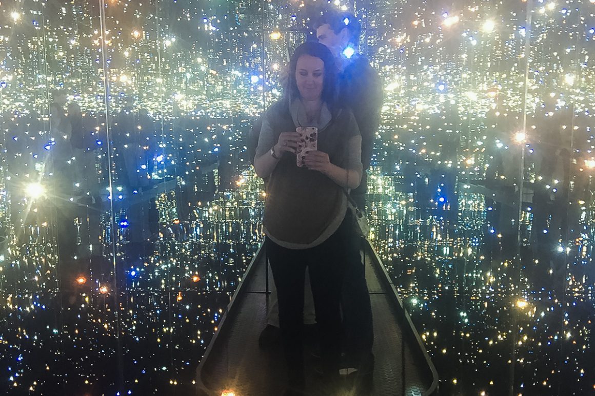 standing on the platform of tiny universes and floating orbs in yayoi kusamas infinity room